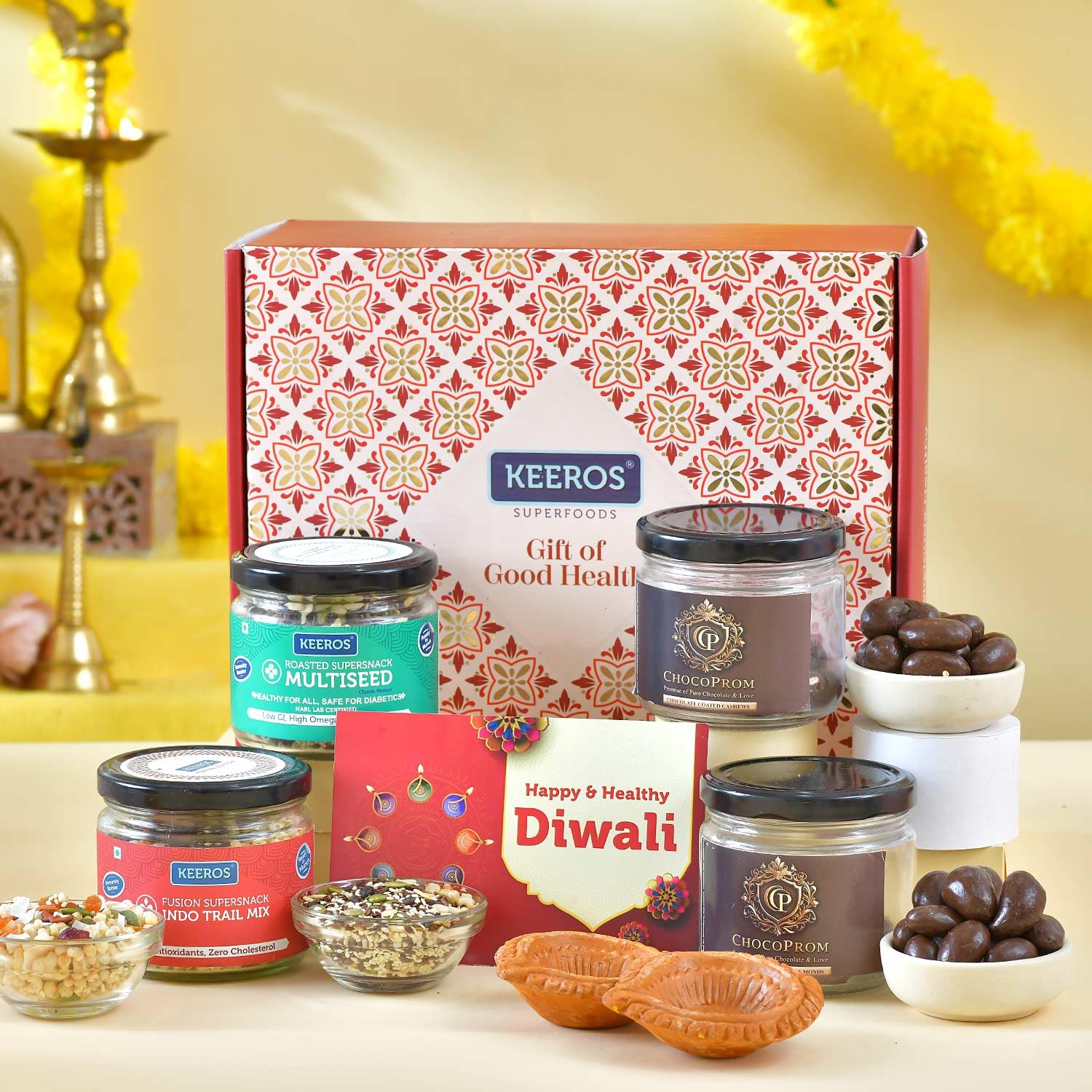 Keeros Healthy Diwali Sweet Gift Hamper with a variety of Chocolate Coated Almond, Cashew & Tasty & Nutritious Super Snacks in Beautiful Glass Jars Packed in Premium Gift Hamper |-image-0