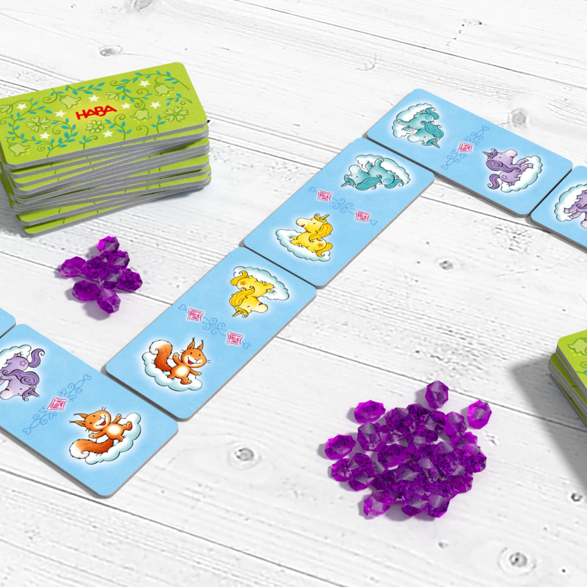 HABA Licornes dans Les Nuages – Collection de Jeux à partir de 3 Ans avec 9 Jeux de dés, de Cartes et de Plateau variés pour 2 à 4 Enfants, faciles à Expliquer – 2012231002
