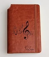 Vista 1 de Personalized Music Notes Journal with Custom text or custom initials engraved Journal leather bound, strip with the same color to keep it closed