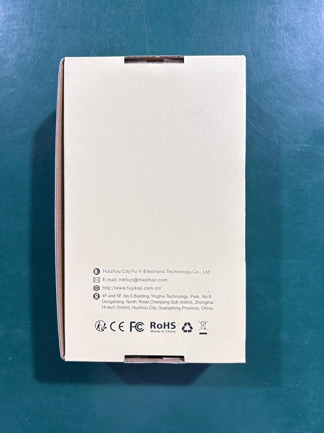 Hand pressing the HOLD button on the multimeter