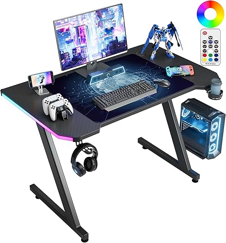 Homall Escritorio para computadora de juegos con superficie de fibra de carbono, mesa de juegos en forma de Z, para PC, oficina en casa con soporte