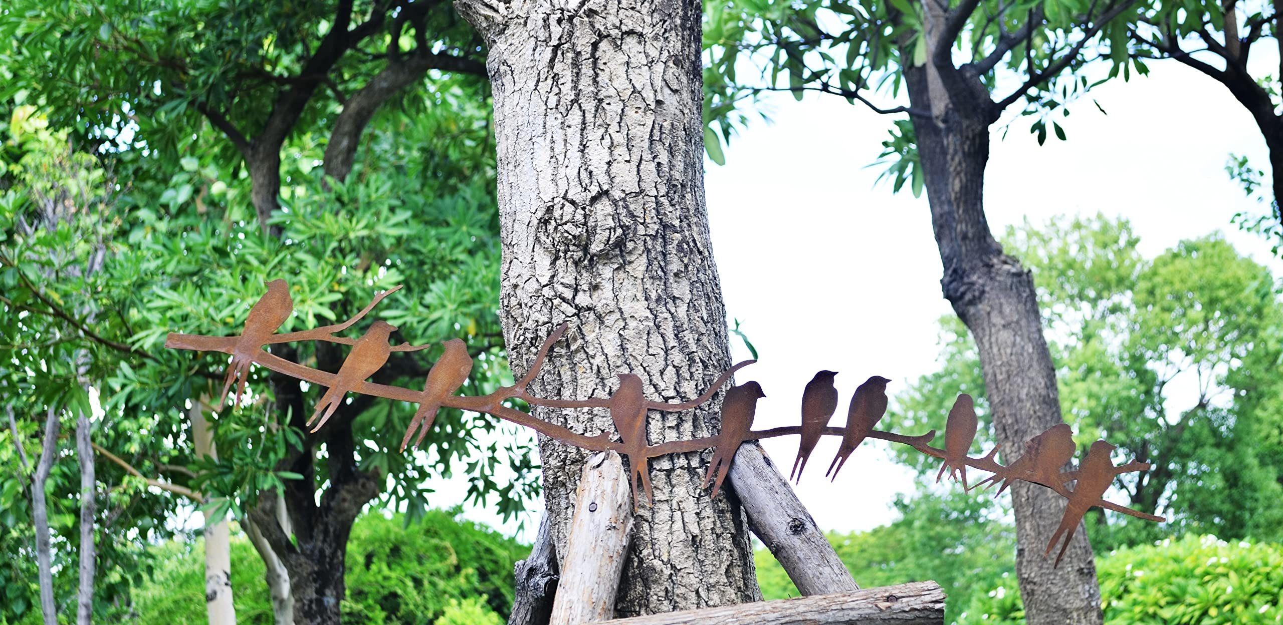 Ten rusty birds perched on a branch 110cm
