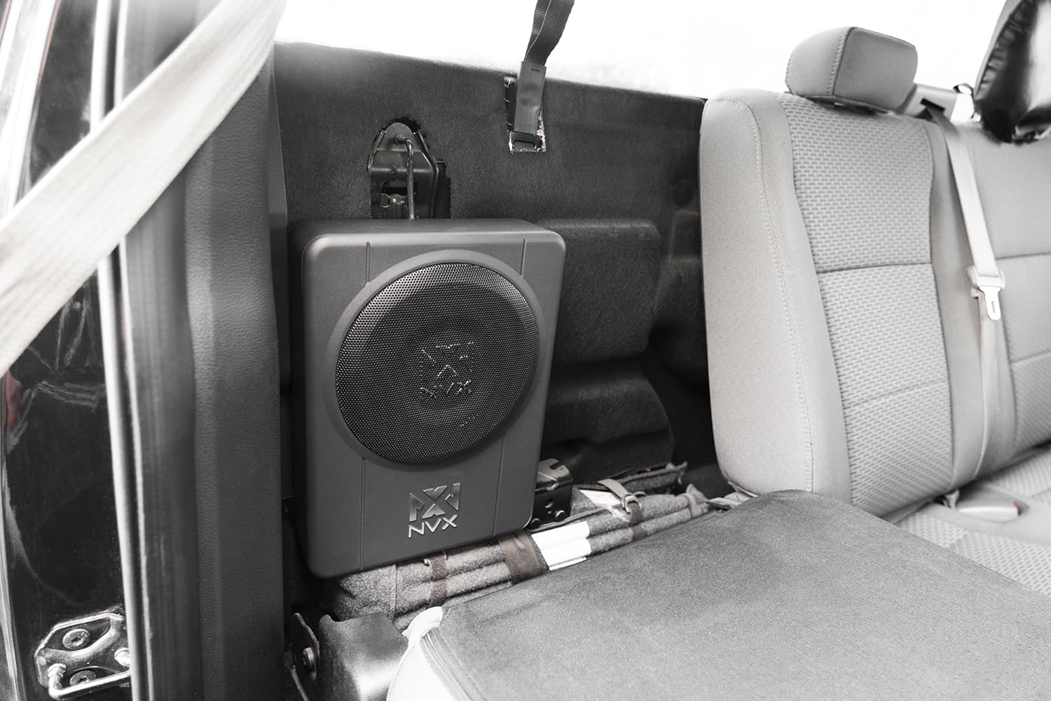 NVX QBUS10P Subwoofer installed under car seat