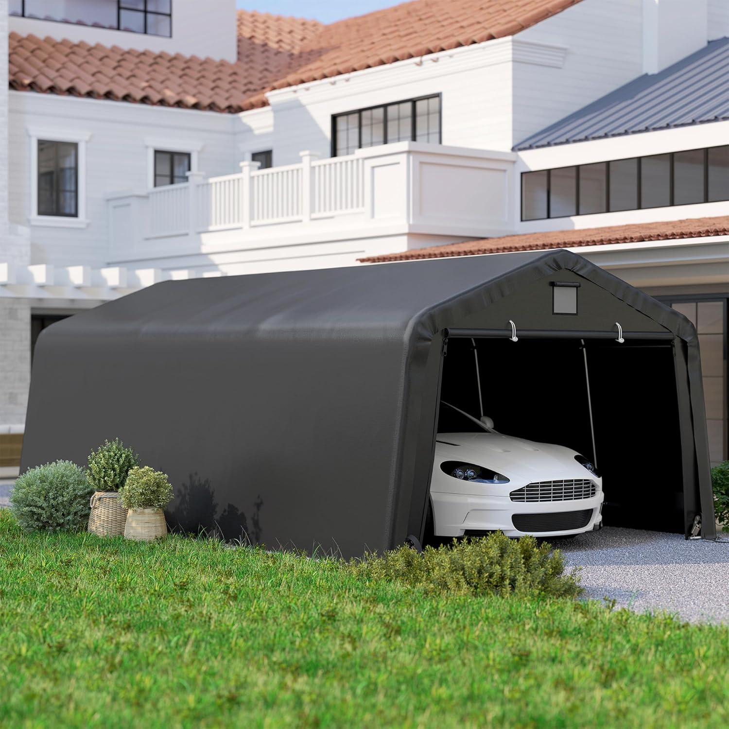An Outsunny carport in a driveway with a white car parked inside, demonstrating its use as a vehicle shelter.