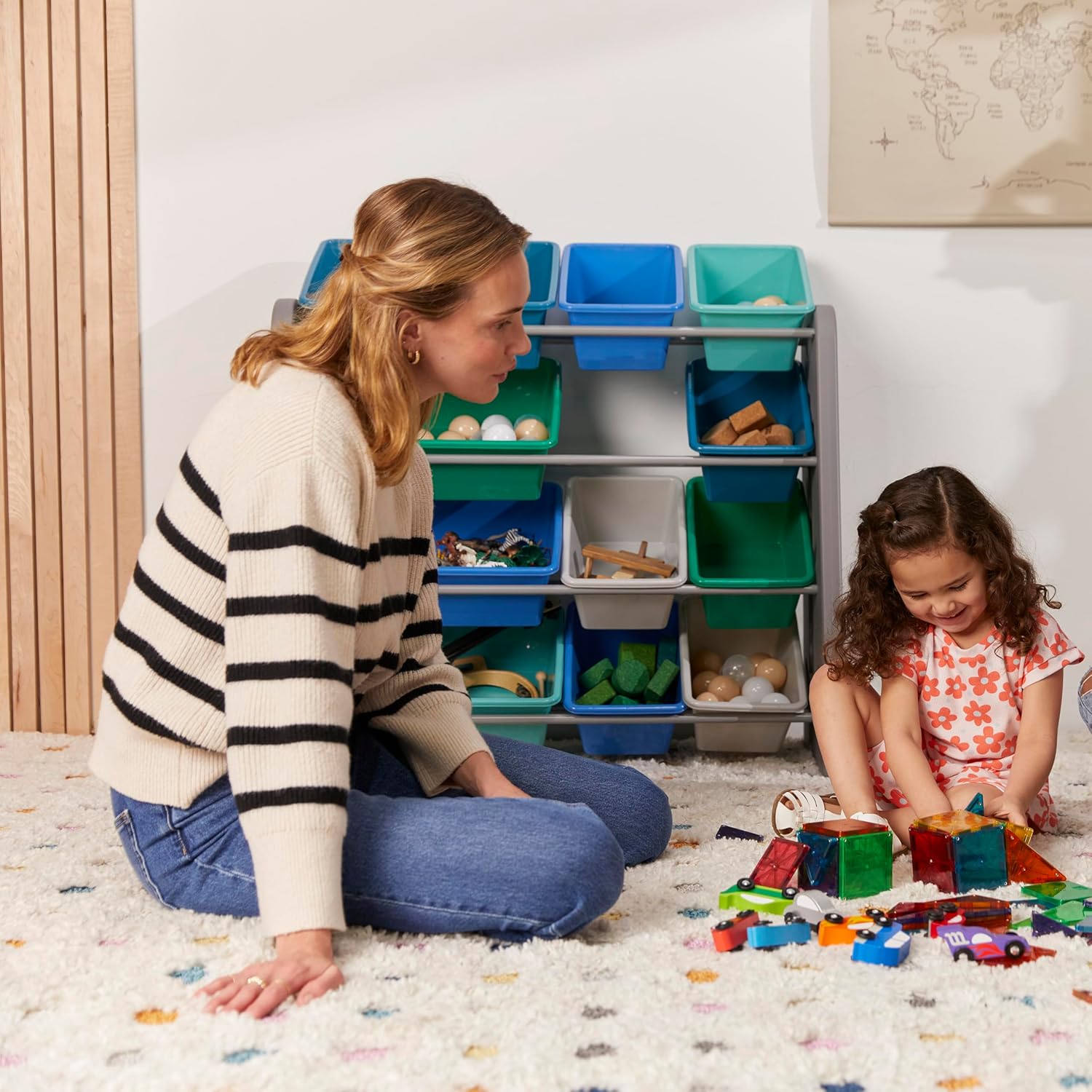 Child reaching for toys in an ECR4Kids Tree Storage Organizer bin