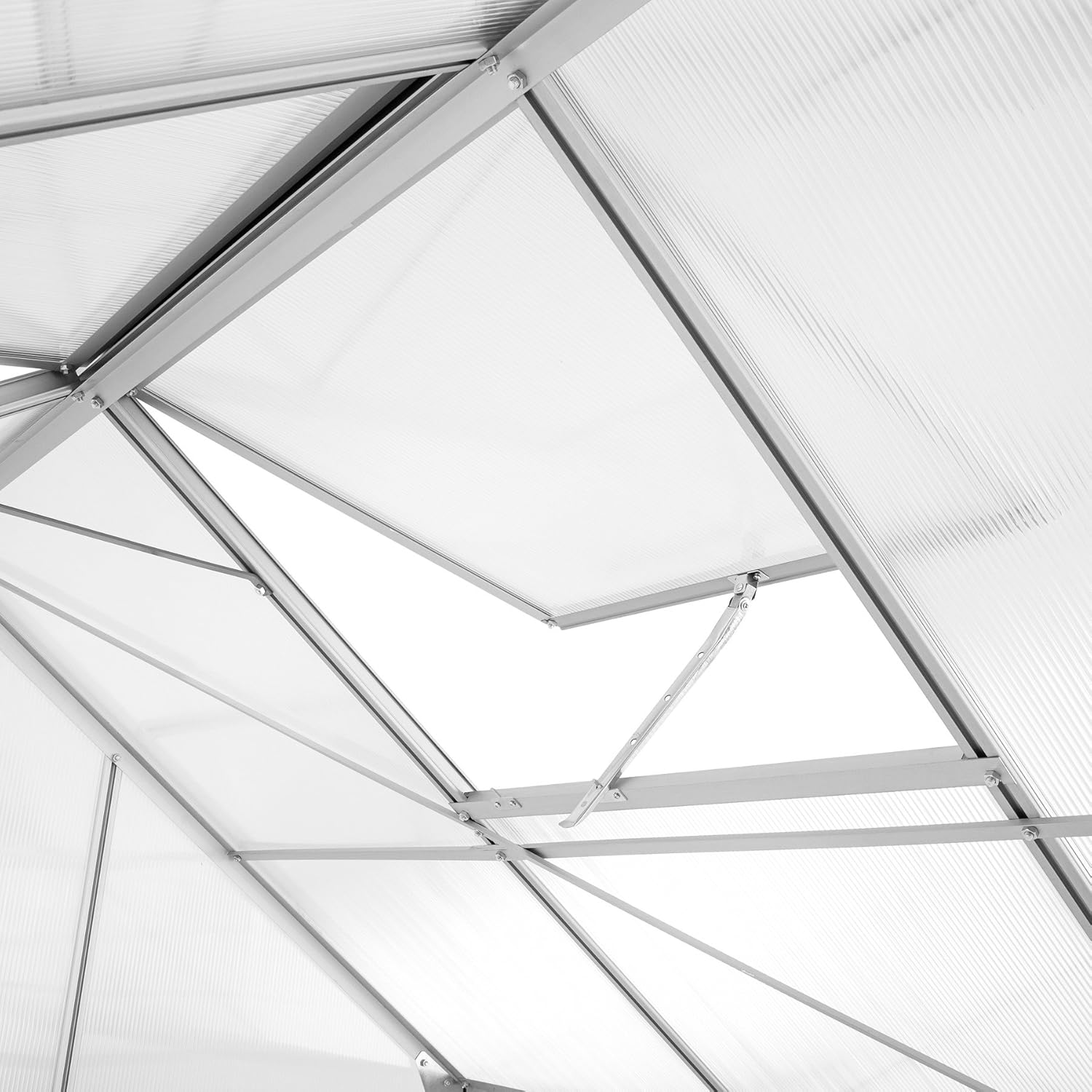 Close-up of an open roof vent on the greenhouse