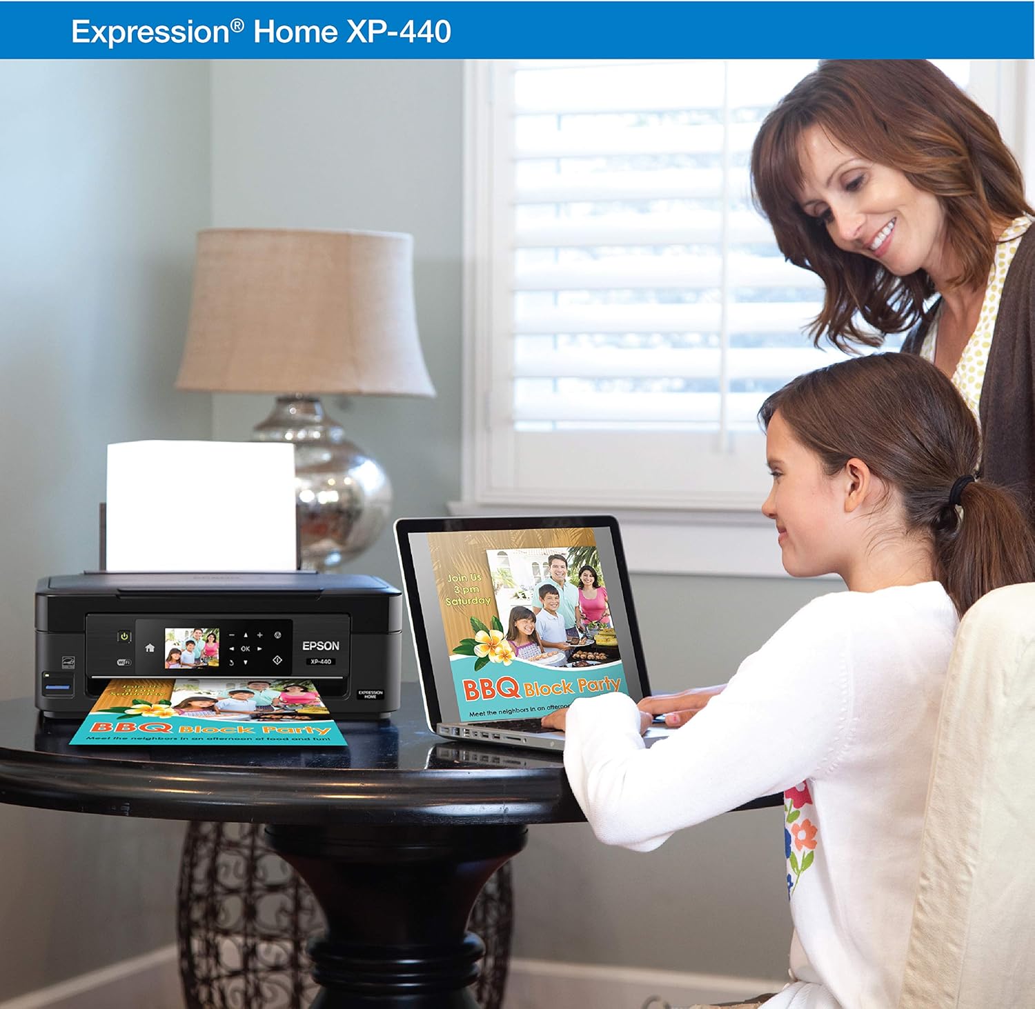 Woman using a laptop to print to an Epson XP-440 printer