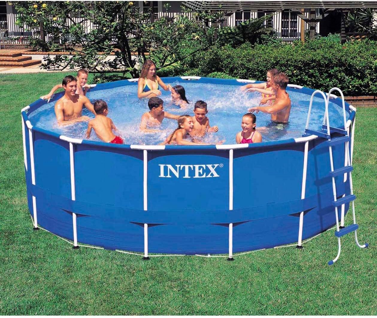Intex Metal Frame Pool Set fully assembled and filled with water, with children playing