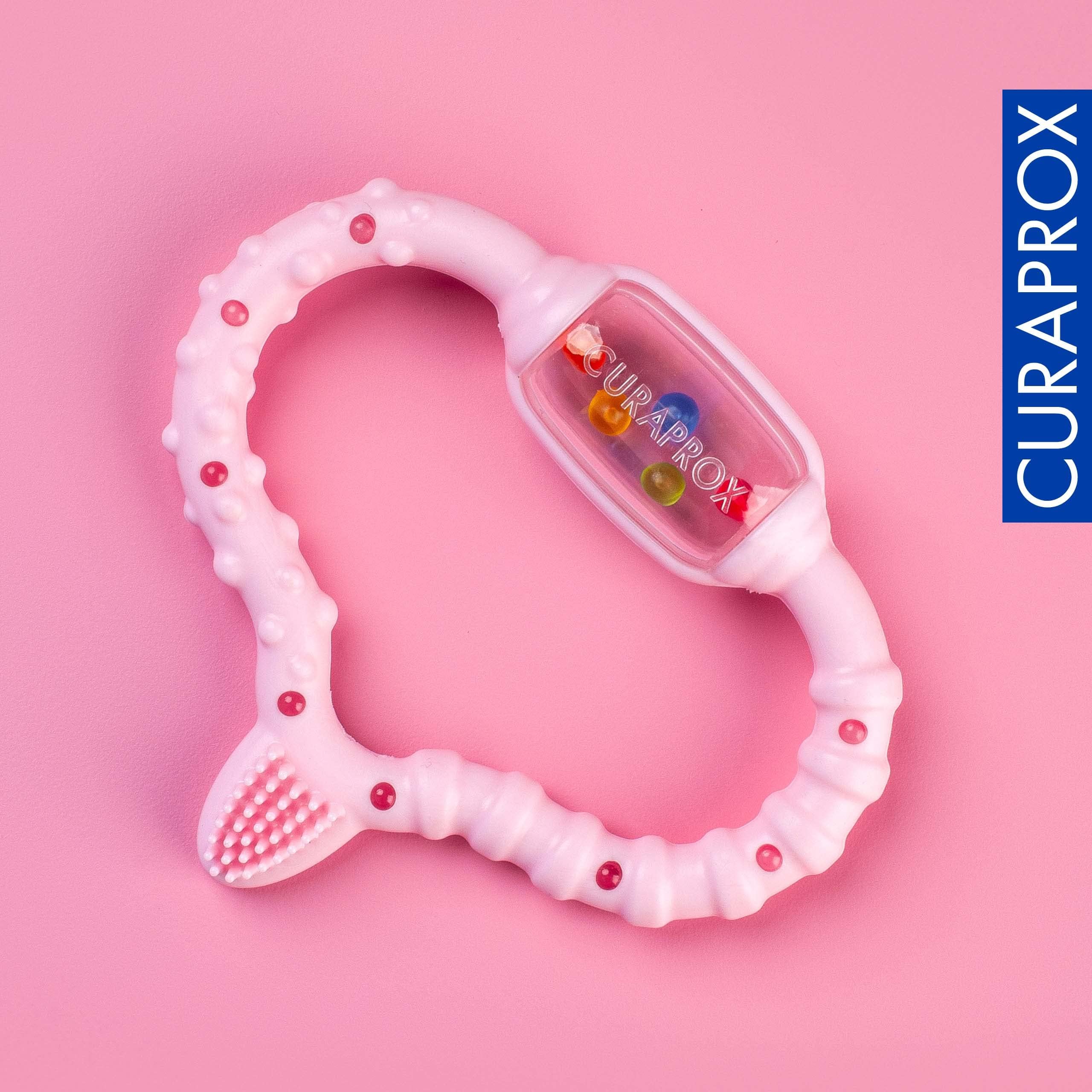 Curaprox Baby Dentizione Anello-Per neonati 0-24 mesi/Lenisce dentizione disagio e incoraggia le capacità motorie/BPA-Free, Rosa, con la formazione spazzolino da denti | Made in Switzerland