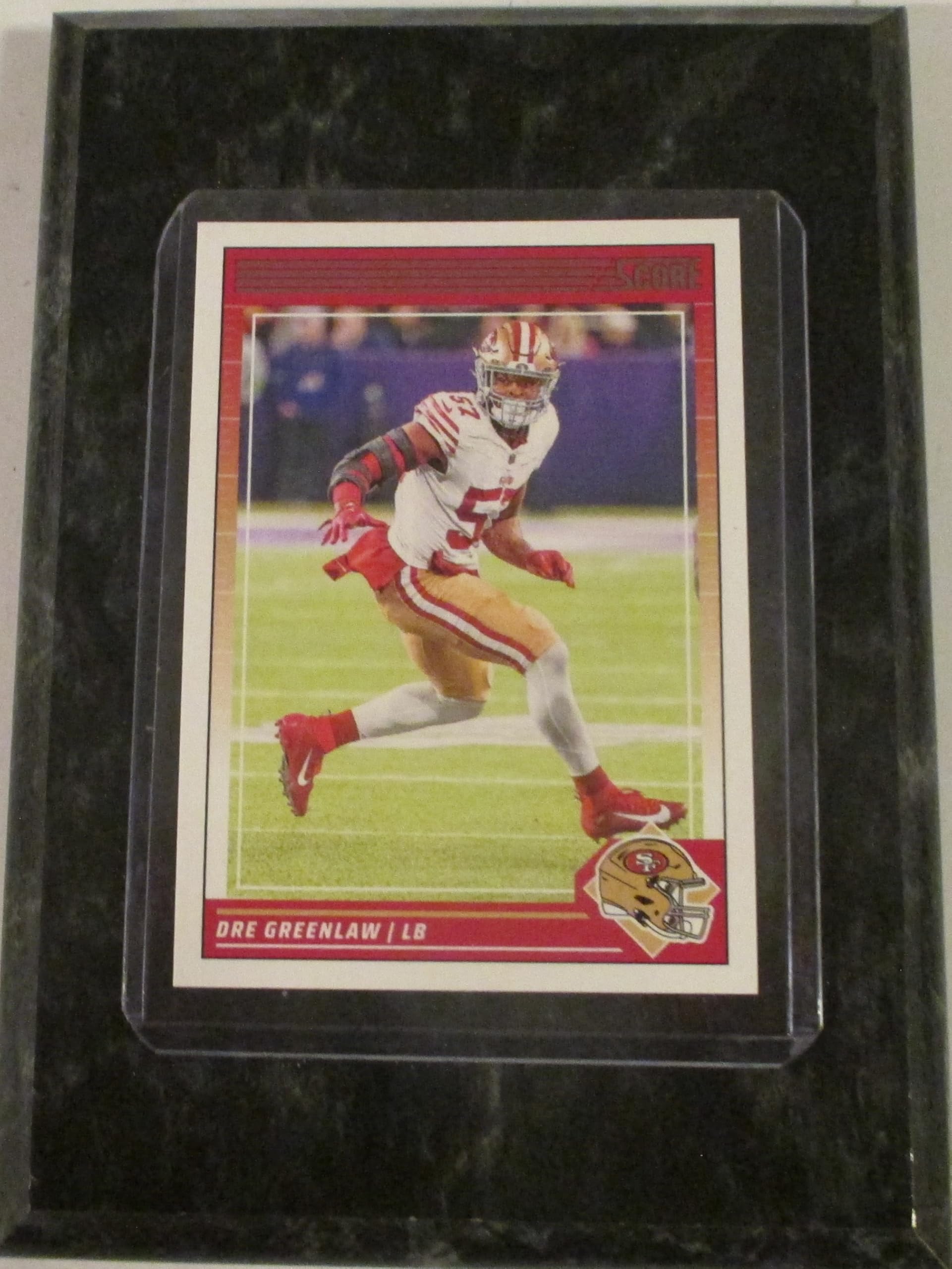 DRE GREENLAW SAN FRANCISCO 2024 SCORE FOOTBALL COLLECTIBLE FOOTBALL CARD MOUNTED ON A "4 X "6 BLACK MARBLE PLAQUE