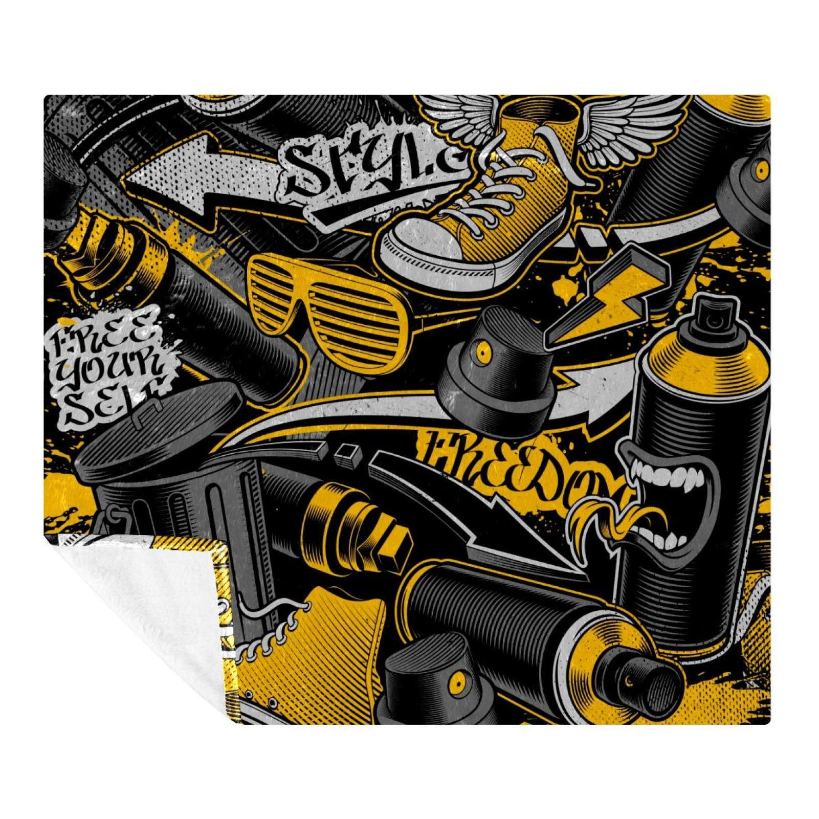 Couverture douce en polaire à motif graffiti pour vos soirées cocooning sur le canapé