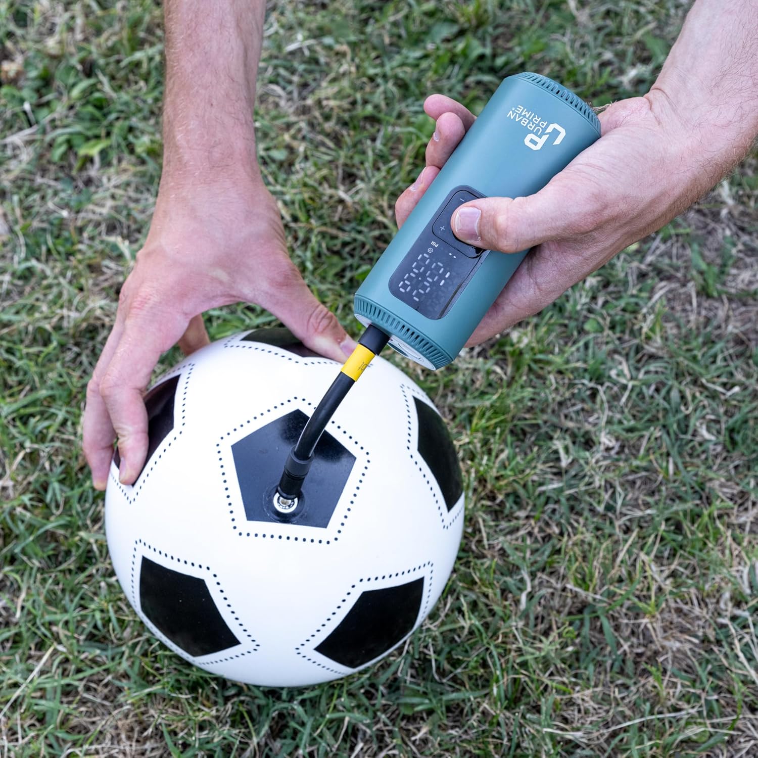 Urban Prime air compressor inflating a soccer ball