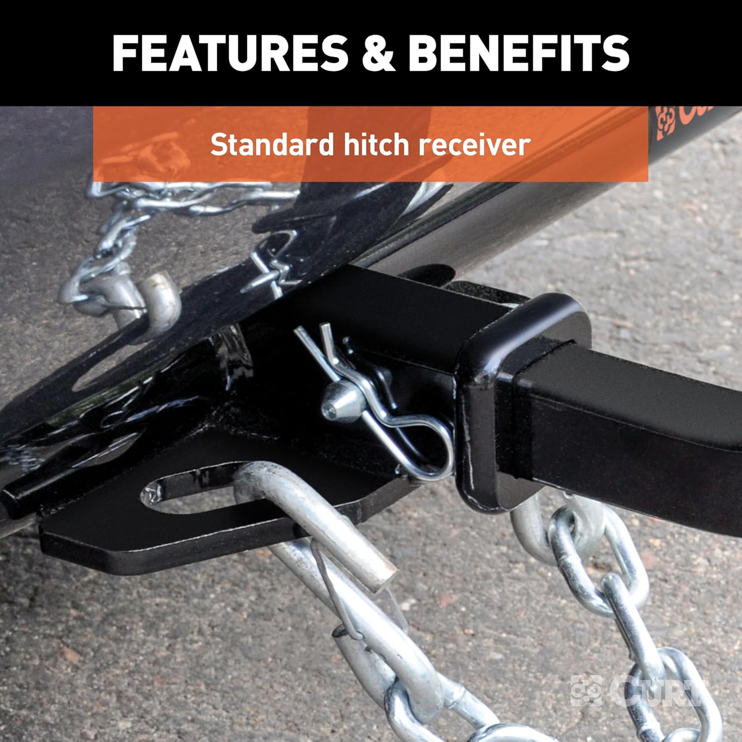 Close-up of a CURT hitch receiver with a ball mount and safety chains attached.