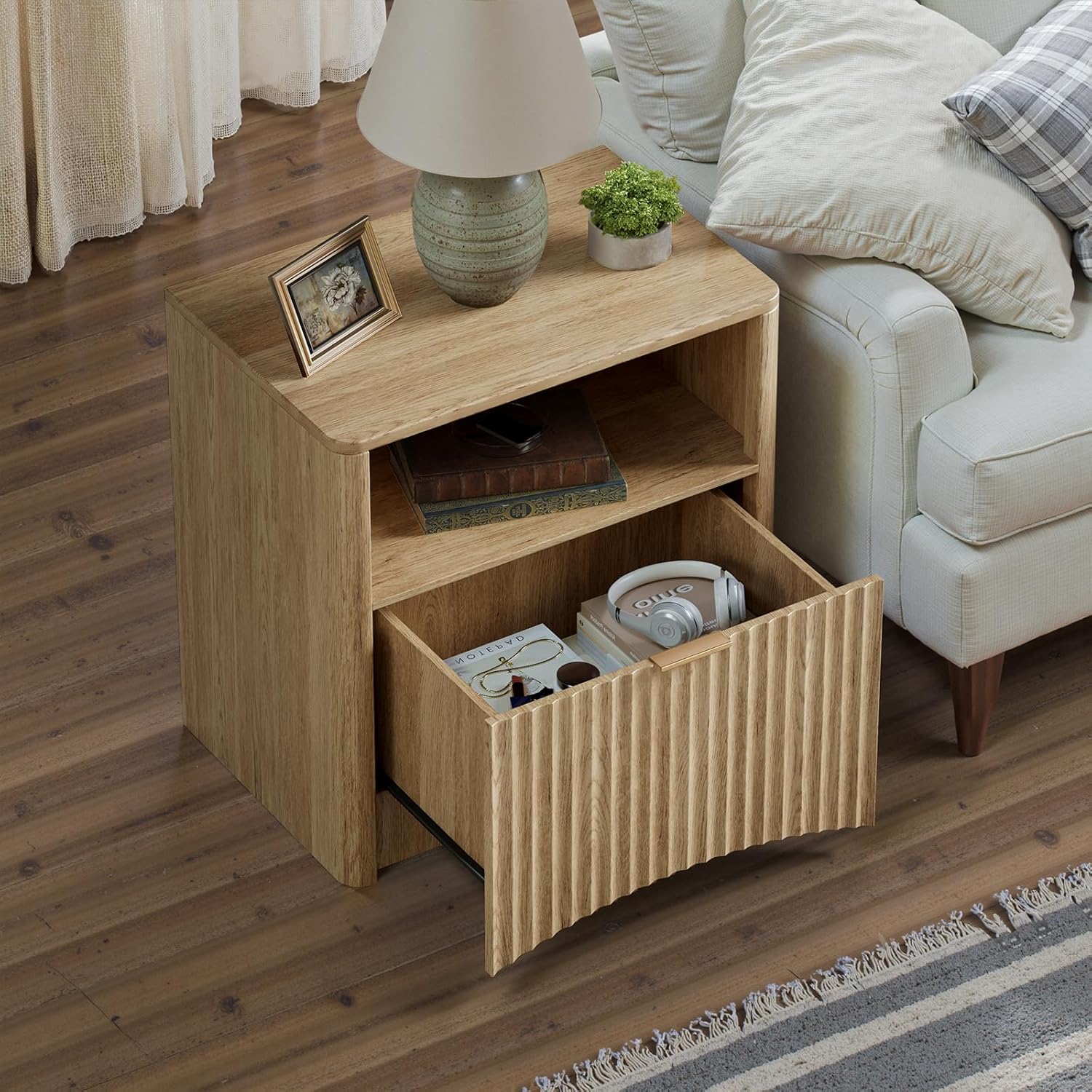 З верху до низу view of the Evermagin Fluted Nightstand with the drawer open, showing items stored inside.