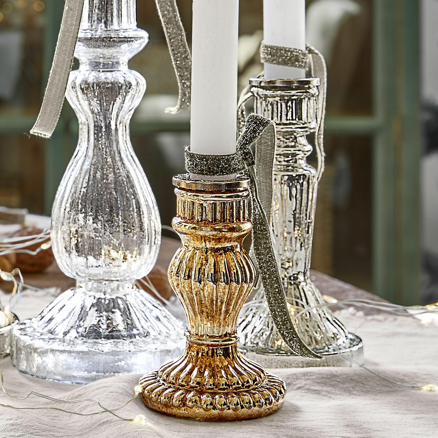 Loberon Kerzenständer 6er Set Quirène, Gold/klar | Mundgeblasen, Sechs Individuelle Designs, Bauernsilber-Finish & Klares Glas, Kerzenhalter, Dekoration, Eisen
