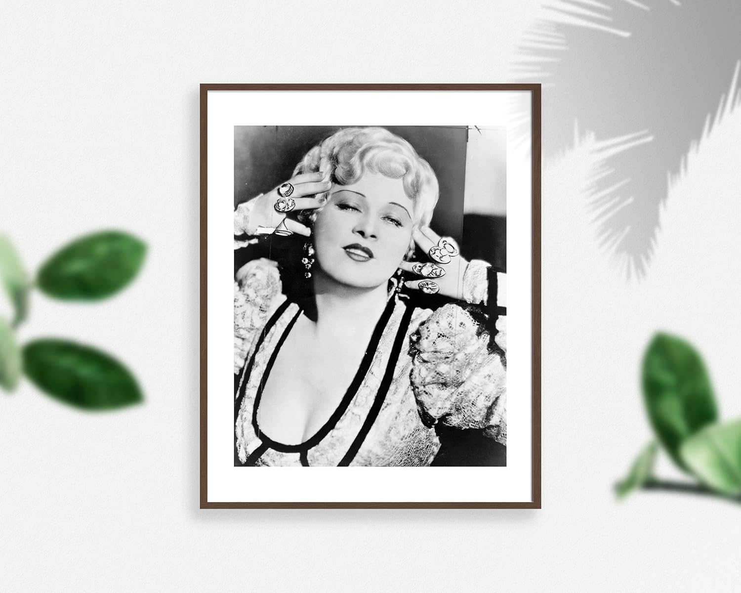 1948 photo Mae West, her head framed by her fingers