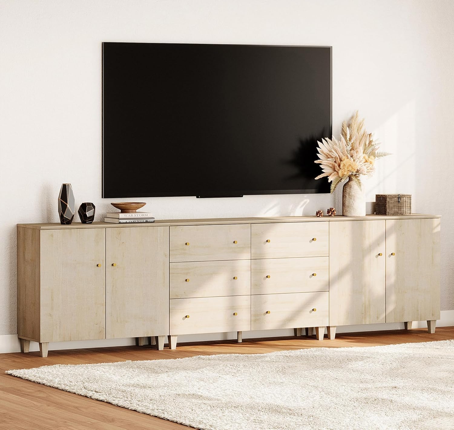 WAMPAT TV stand in a living room with a large TV and decorative items