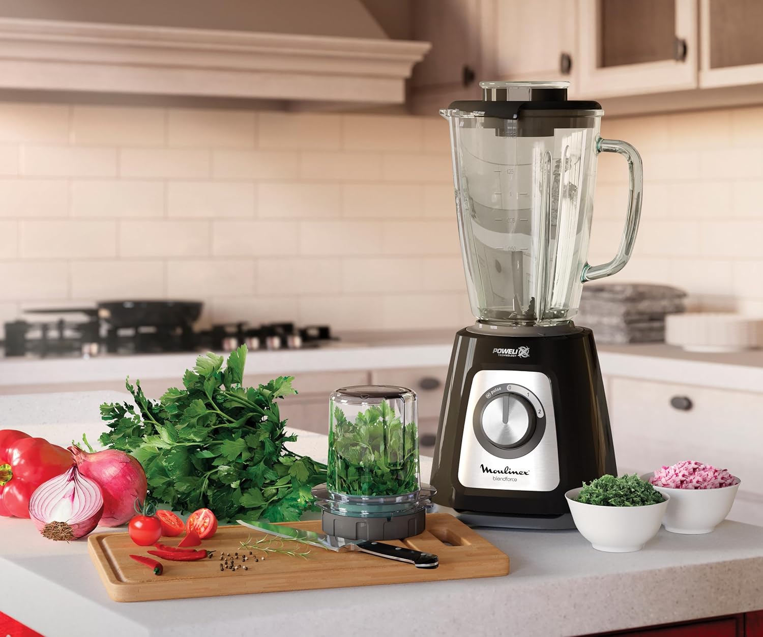 Moulinex blender with chopper accessory processing herbs