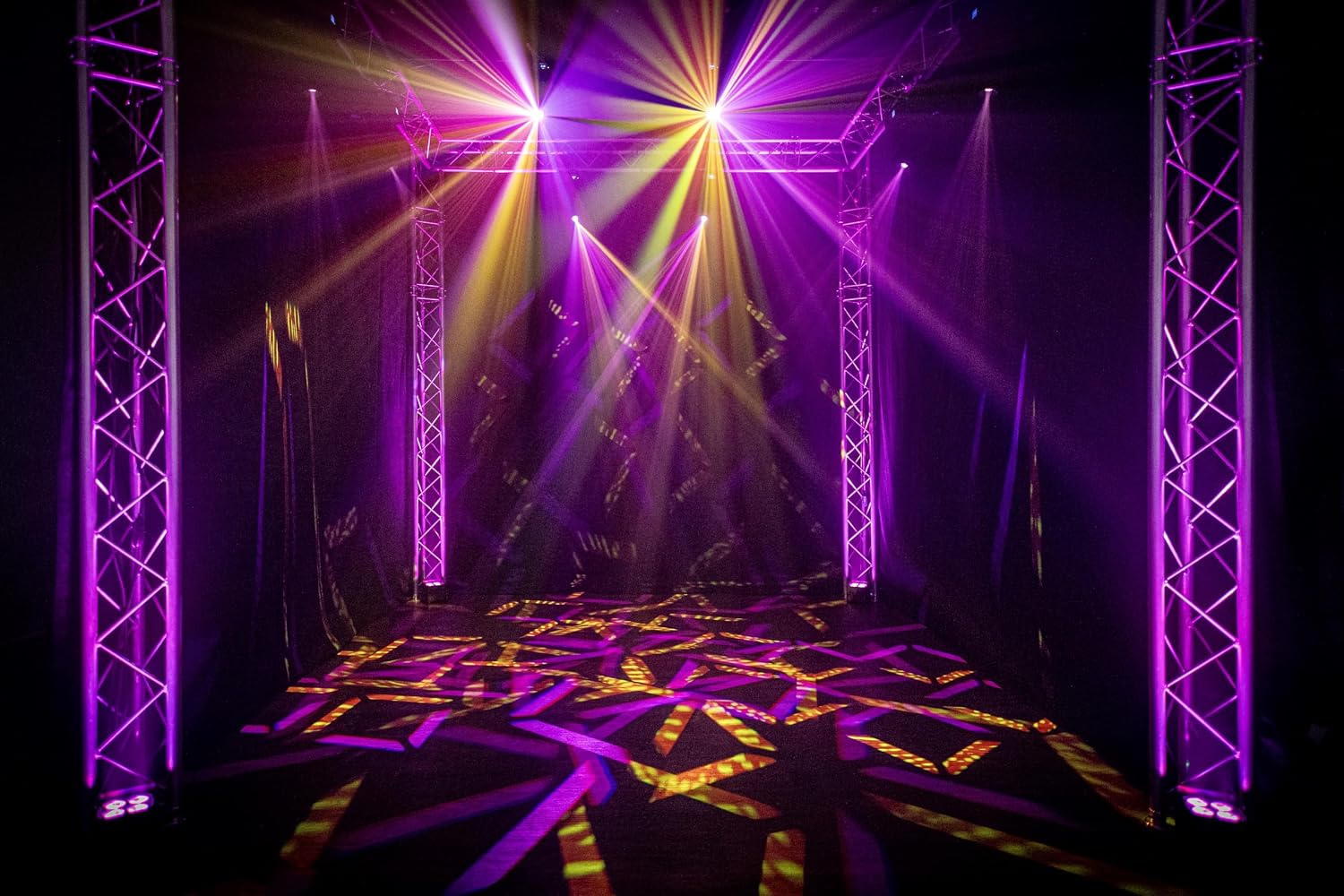 Stage setup with multiple ColorKey Mover Spot 150 lights creating dynamic patterns