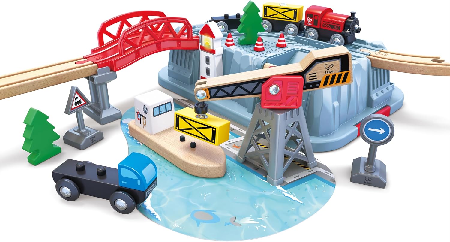 Close-up of the Hape Railway Bucket Harbour Set E8769 harbor area with crane, boat, and train