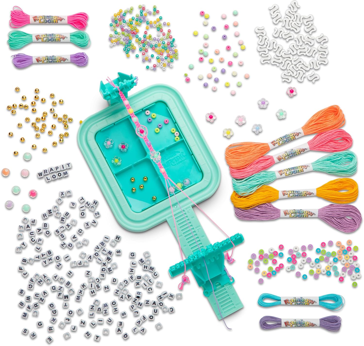 Overhead view of the Rainbow Loom Wrapit Loom with various beads and threads organized.
