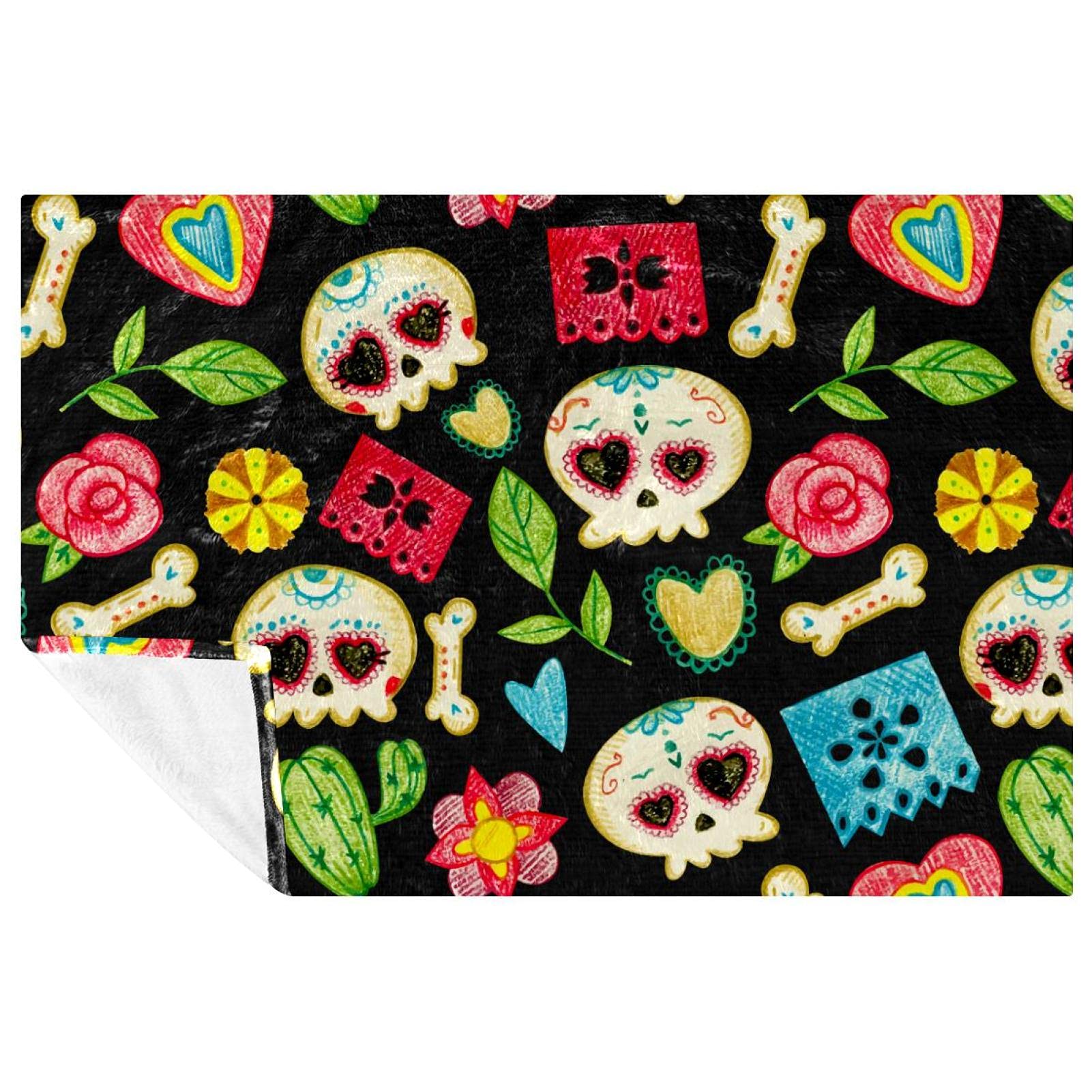 Couverture chaude motif tête de mort contre le froid sur le canapé ou lit