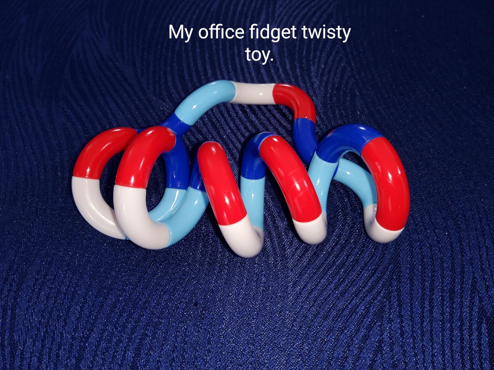 Fidget toy tucked into a backpack pocket