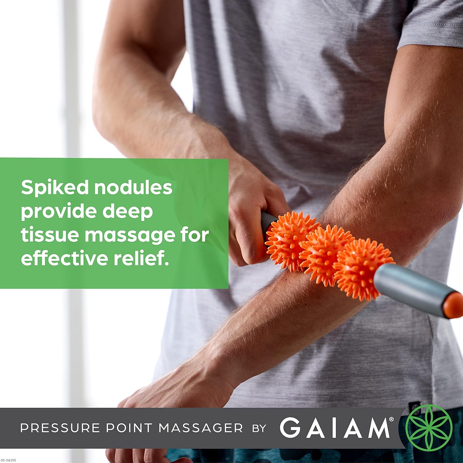 Person using Gaiam Restore Pressure Point Muscle Roller on their arm