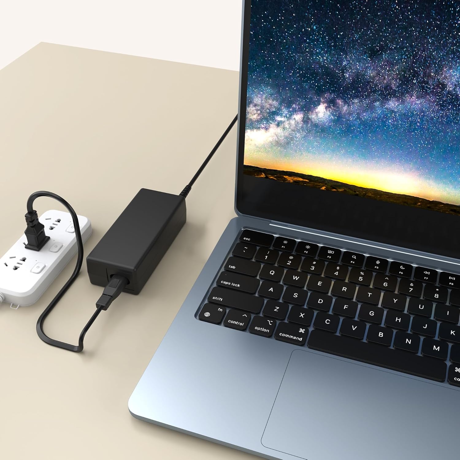 The AC adapter connected to a power strip and a laptop, demonstrating a typical setup for charging or powering a device.