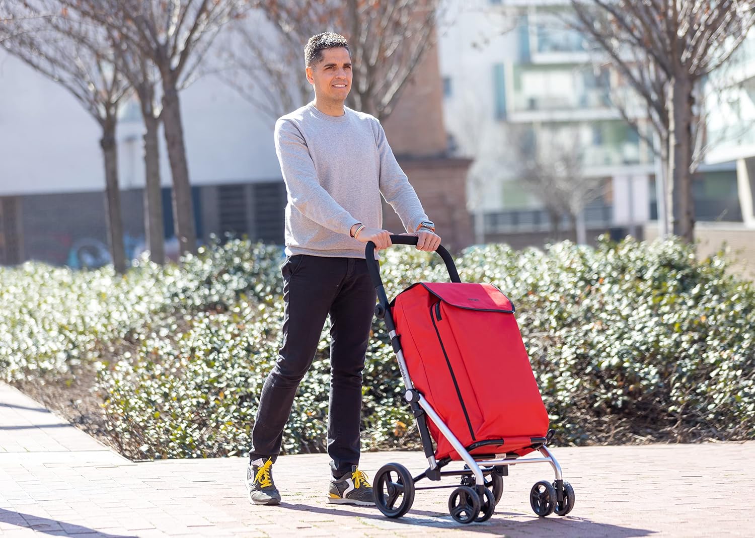 Person pushing Carlett Shopping Trolley in 4-wheel mode