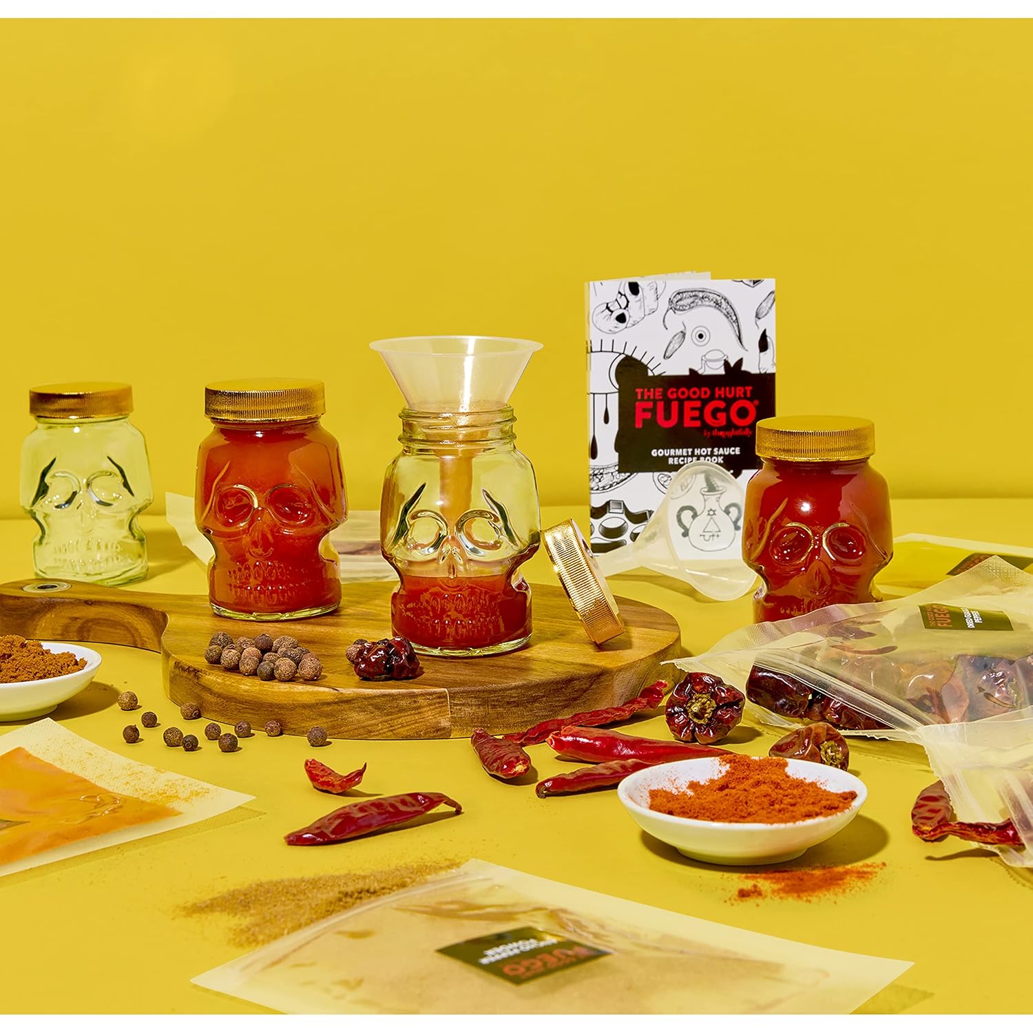 The Good Hurt Fuego by Thoughtfully, DIY Hot Sauce Set, Includes 4 Skull Shaped Reusable Glass Jars, 2 Funnels, Seasonings, Gloves and Recipe Book to Make Your Own Hot Sauce