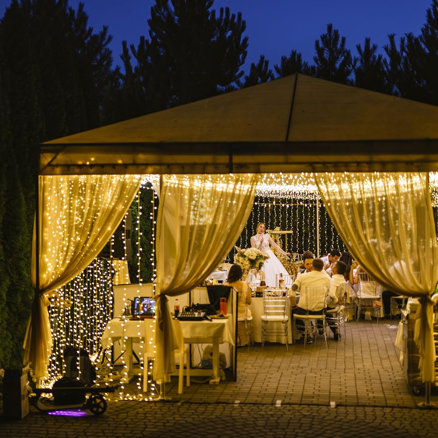 LQWELL LED Curtain Lights decorating an outdoor event space, creating a festive atmosphere.