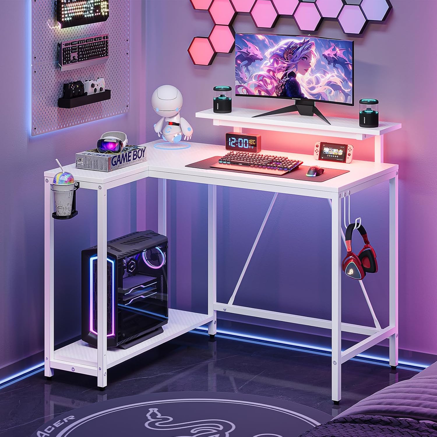 Pinmoco 42-inch L-Shaped Gaming Desk in a modern gaming setup with LED lights