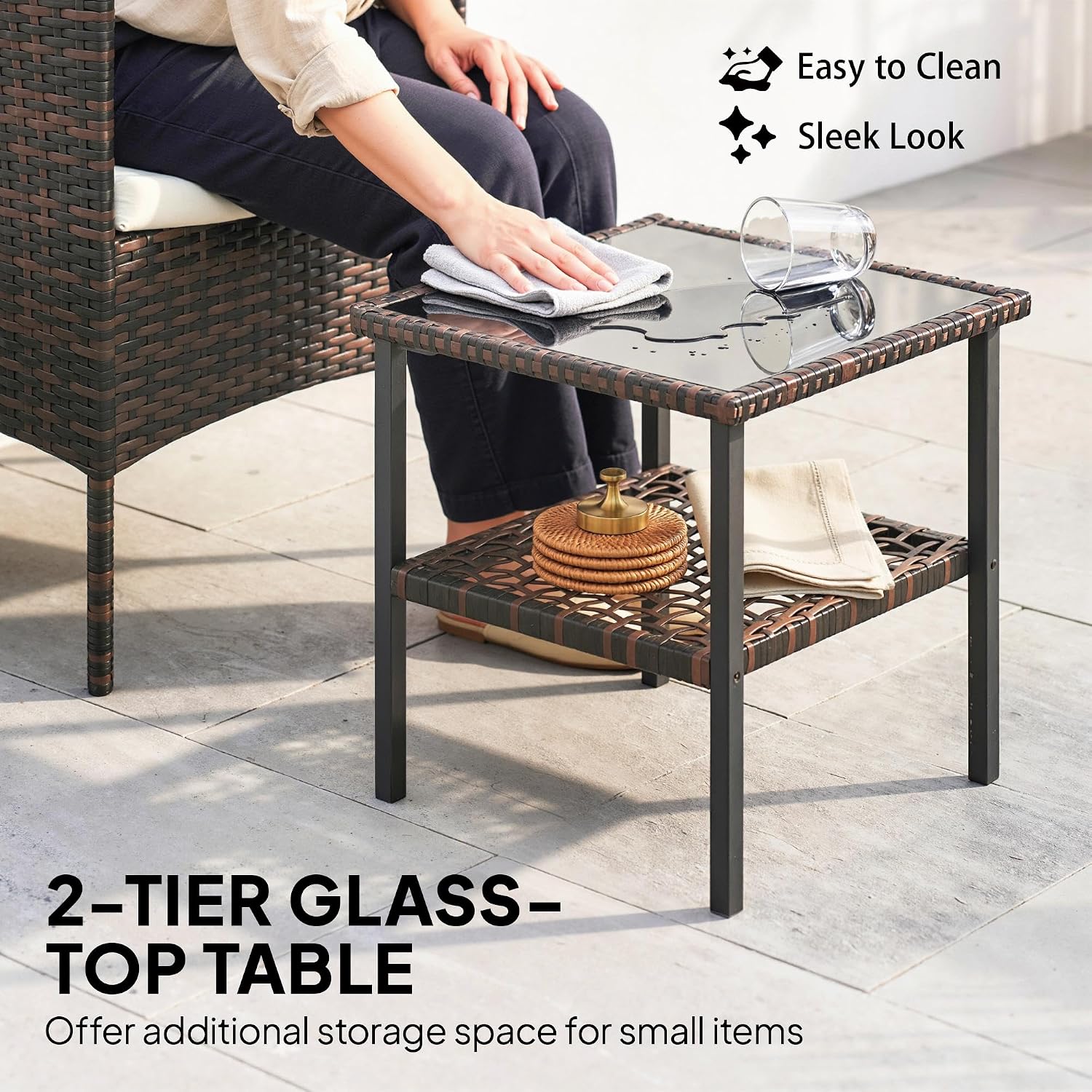 Close-up of the 2-tier glass-top table, showing its surface and lower storage shelf.