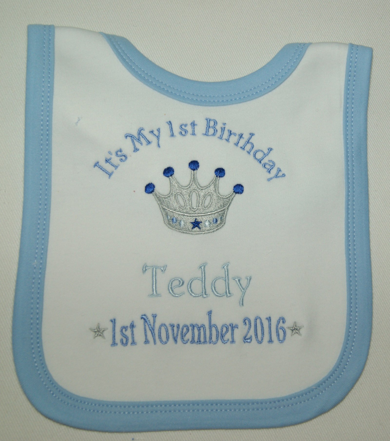 Boy’s Personalised 1st Birthday Bib (White with blue trim)