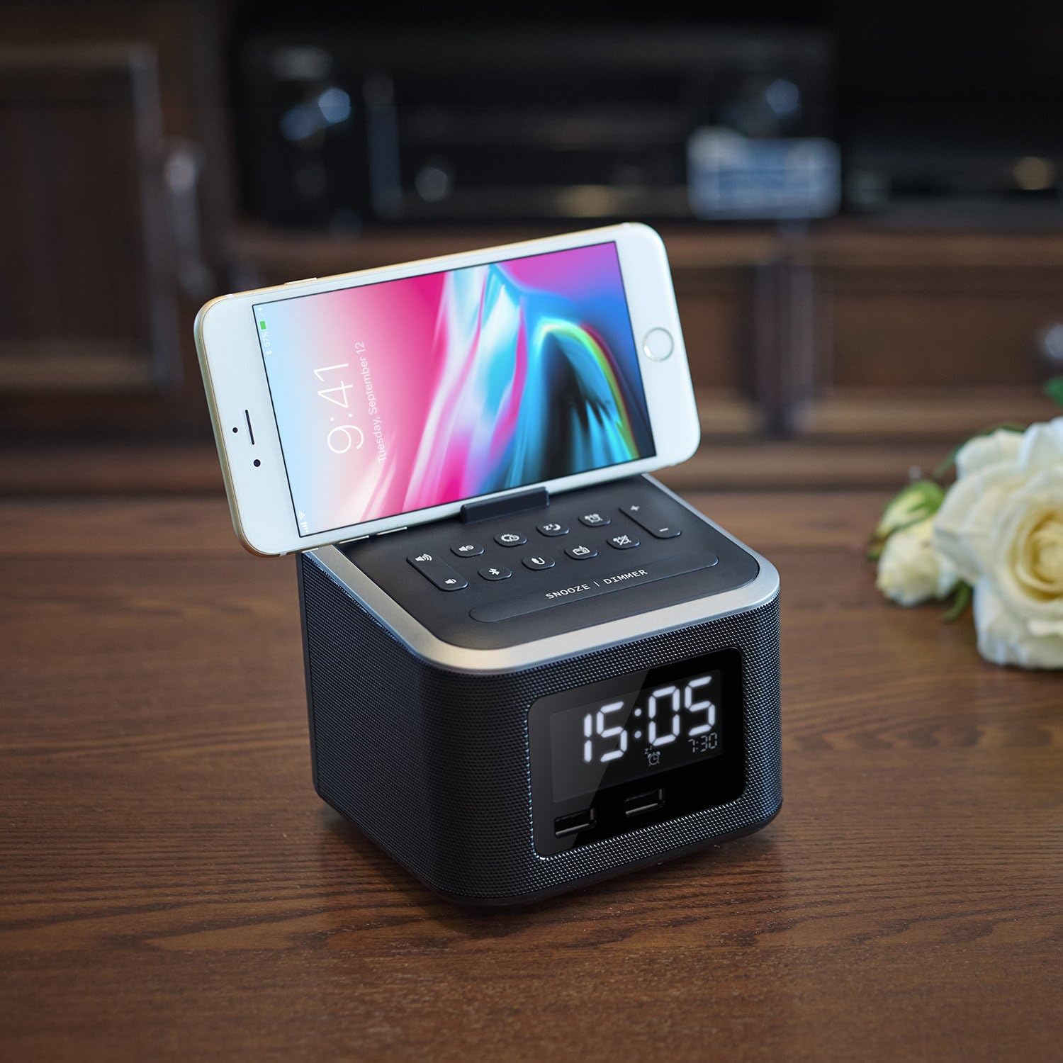 Smartphone placed in the integrated stand on top of the Homtime Alarm Clock Radio
