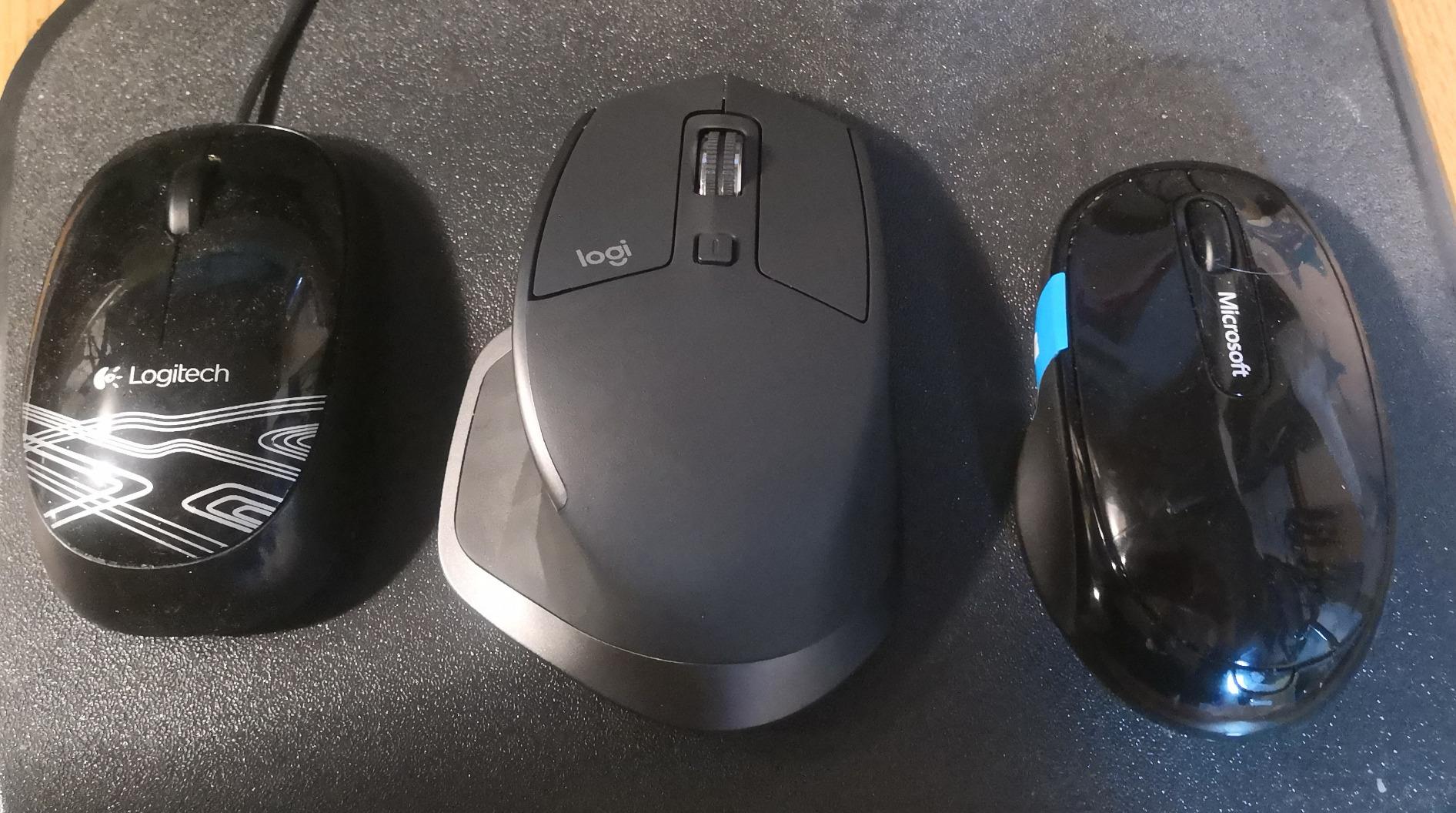 Hand holding Logitech MX Master 2S mouse