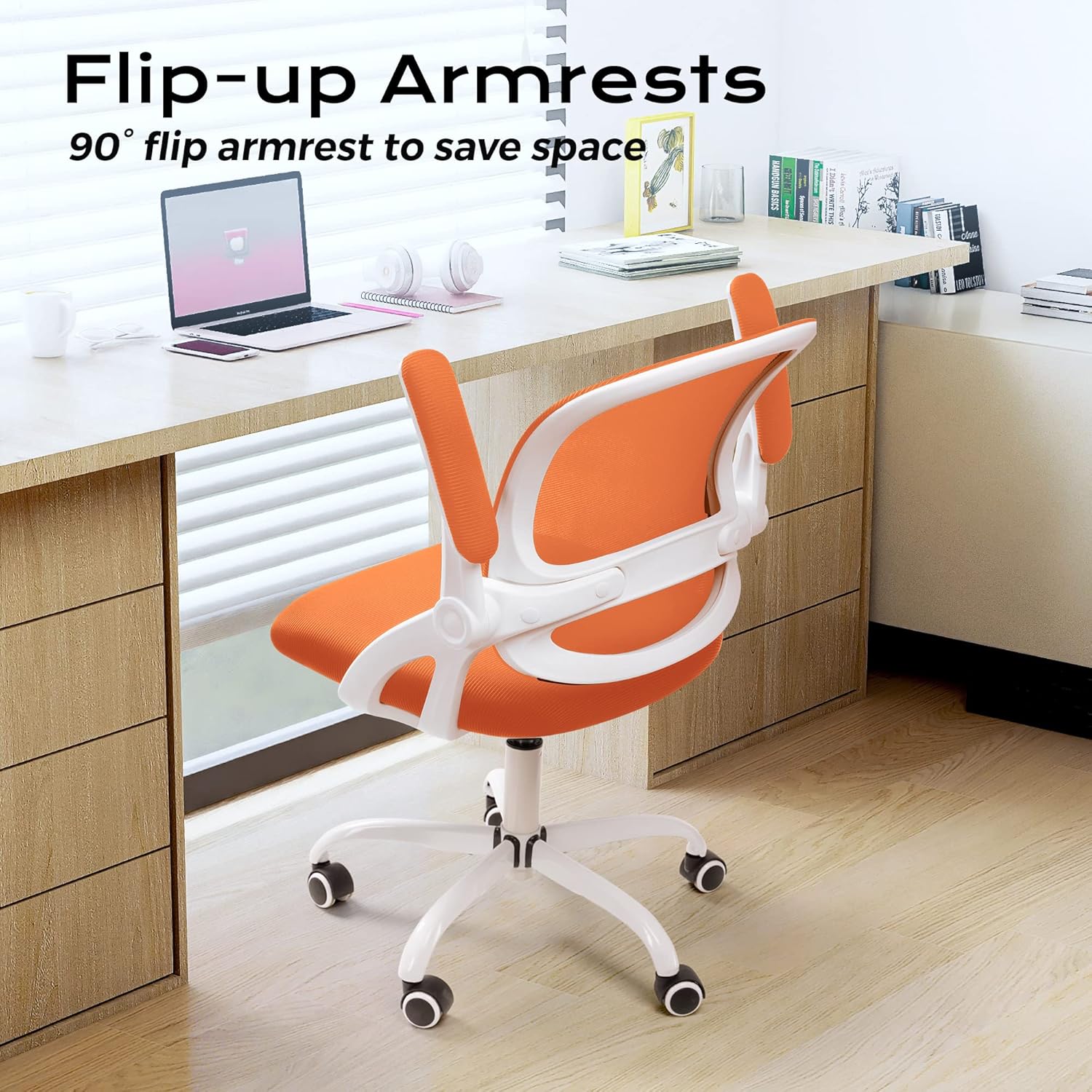 KERDOM office chair with armrests flipped up 90 degrees, positioned under a desk.