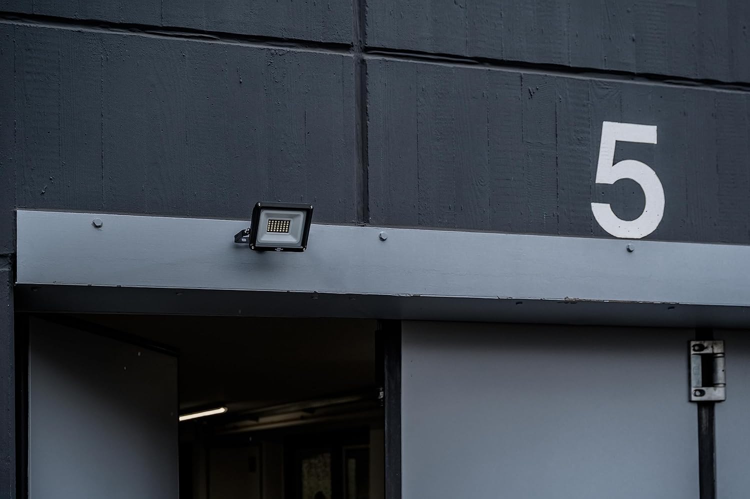 Brennenstuhl JARO 3060 LED Floodlight installed on an exterior wall above an entrance