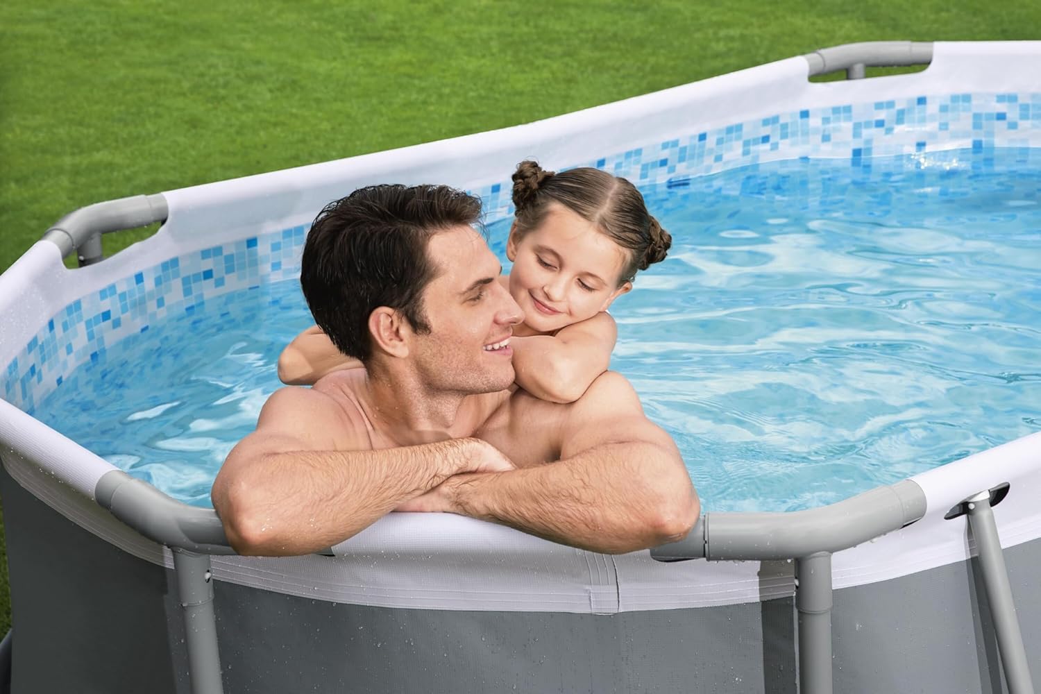A man and a child enjoying the Bestway Power Steel Oval Pool.