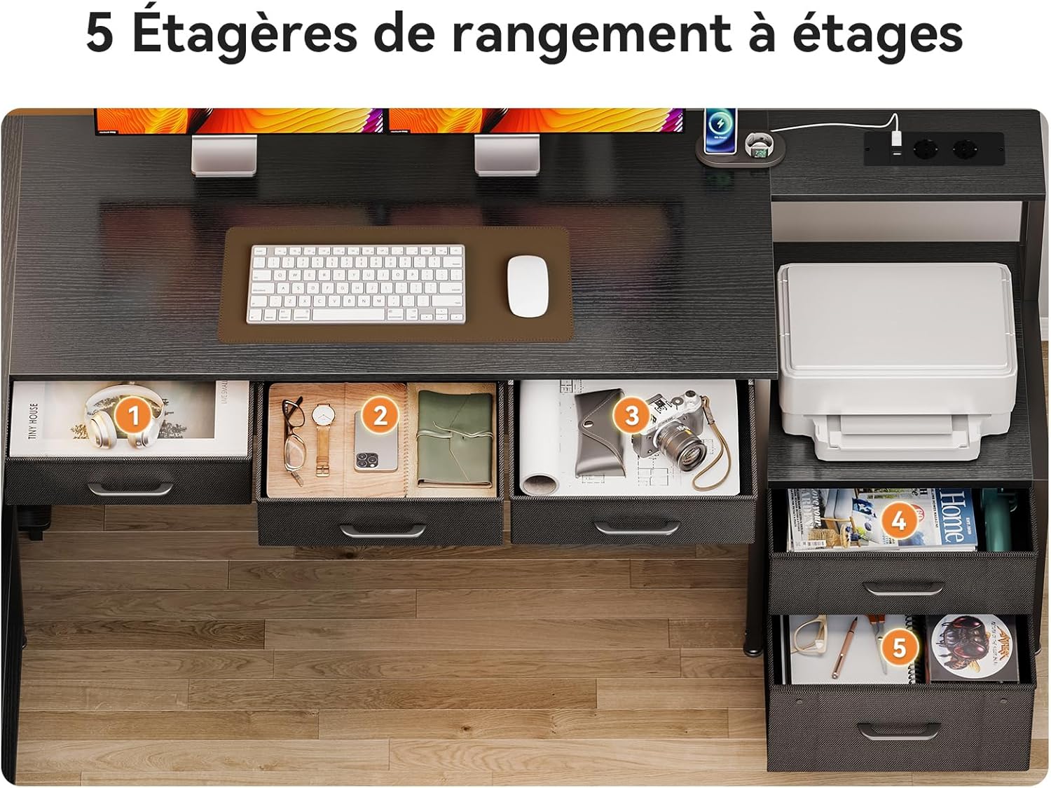 Overhead view of the desk showing five open drawers, filled with various office supplies and personal items, highlighting storage capacity.