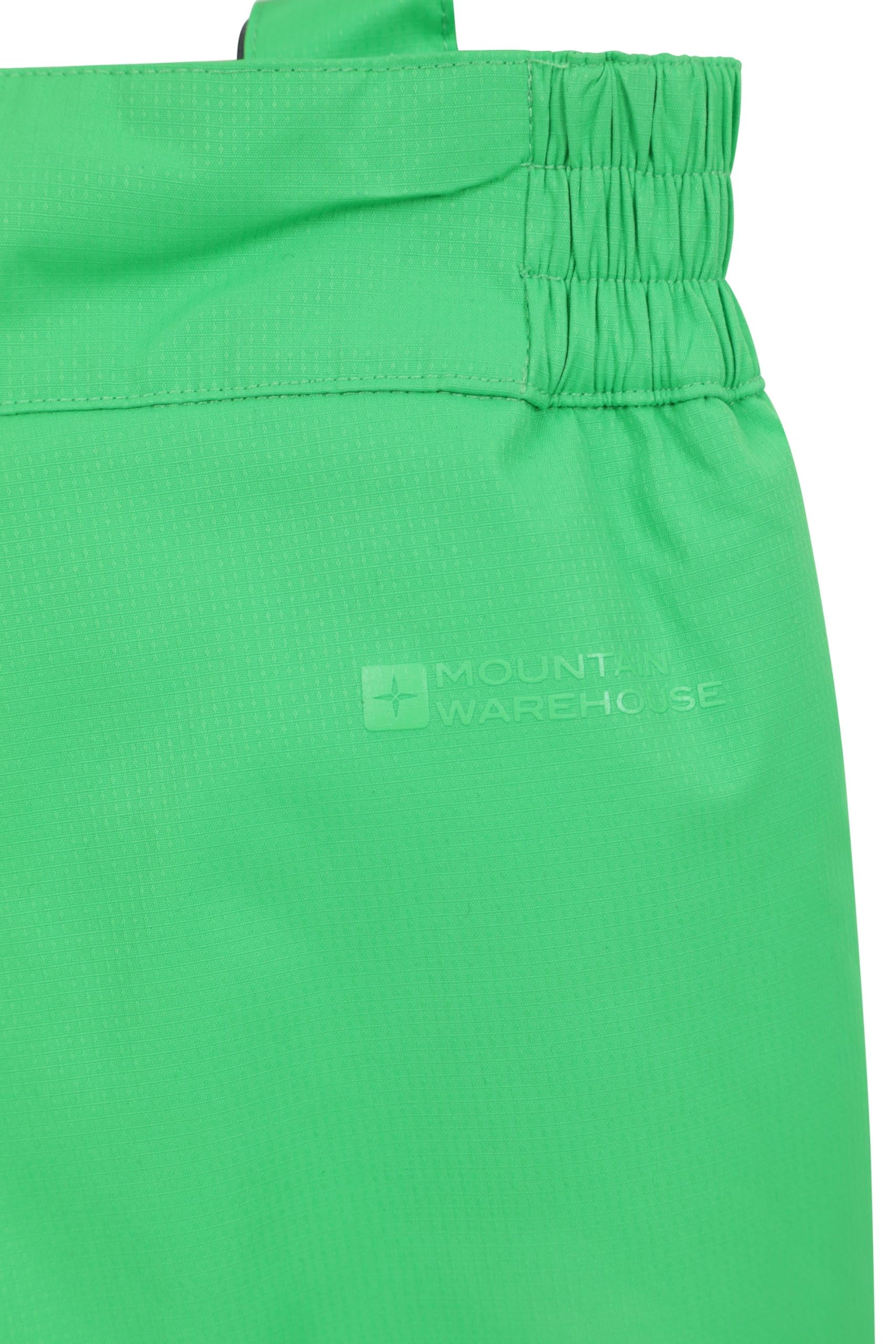 Mountain Warehouse Pantalón de esquí Raptor para niños - Rodillas reforzadas, 2 Bolsillos, pantalón Impermeable a la Nieve, Cremallera en el Tobillo y Tirantes Desmontables, Invierno Verde 13 Años