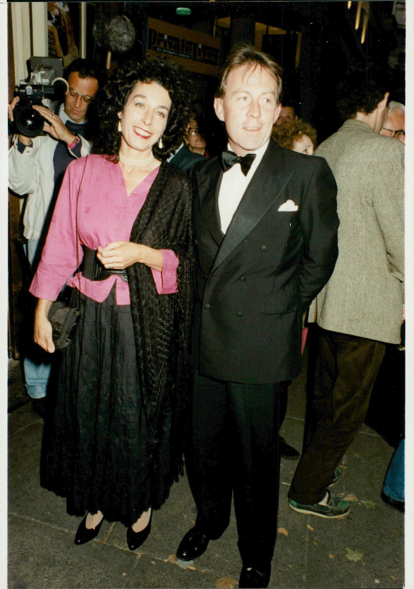 Vintage photo of Roddy Llewellyn and his wife Tatiana Soskin arrive at the Aldwyeh Theater.