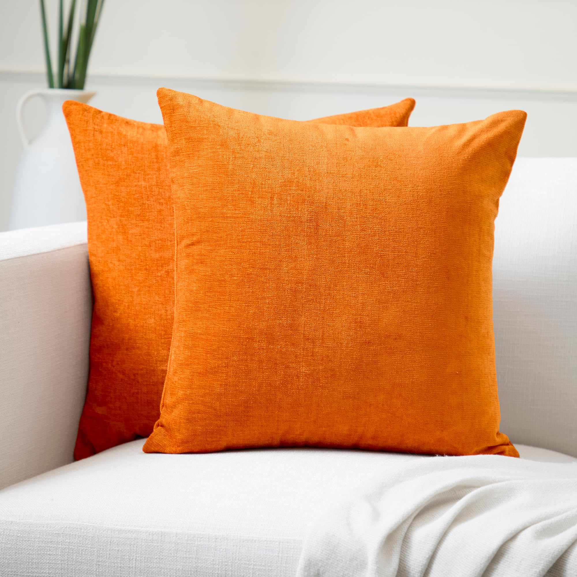 Housse de coussin chenille orange contre les canapés ternes 40x40cm