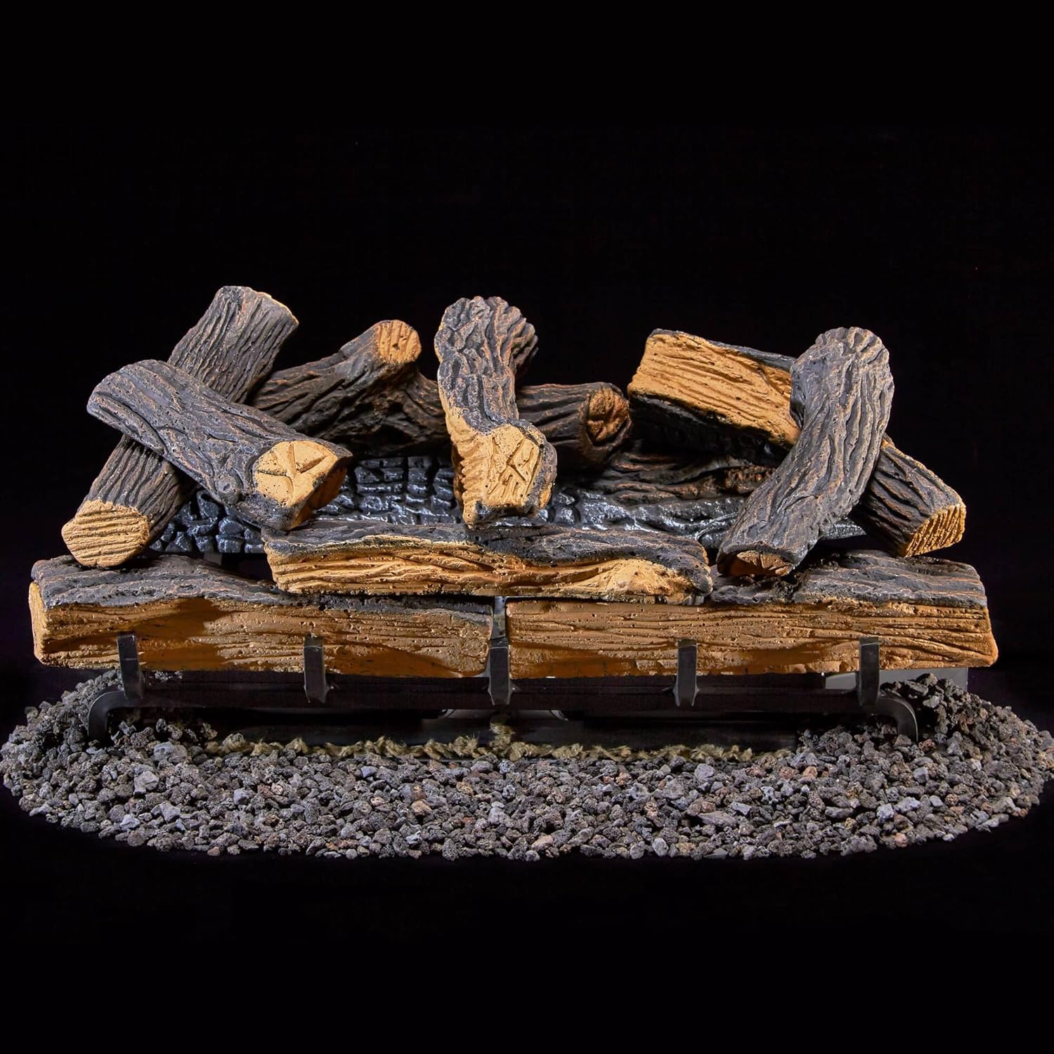 ക്ലോസ് അപ്പ് view of the Duluth Forge DLS-24R-1 ceramic logs arranged on the metal grate, ready for operation.