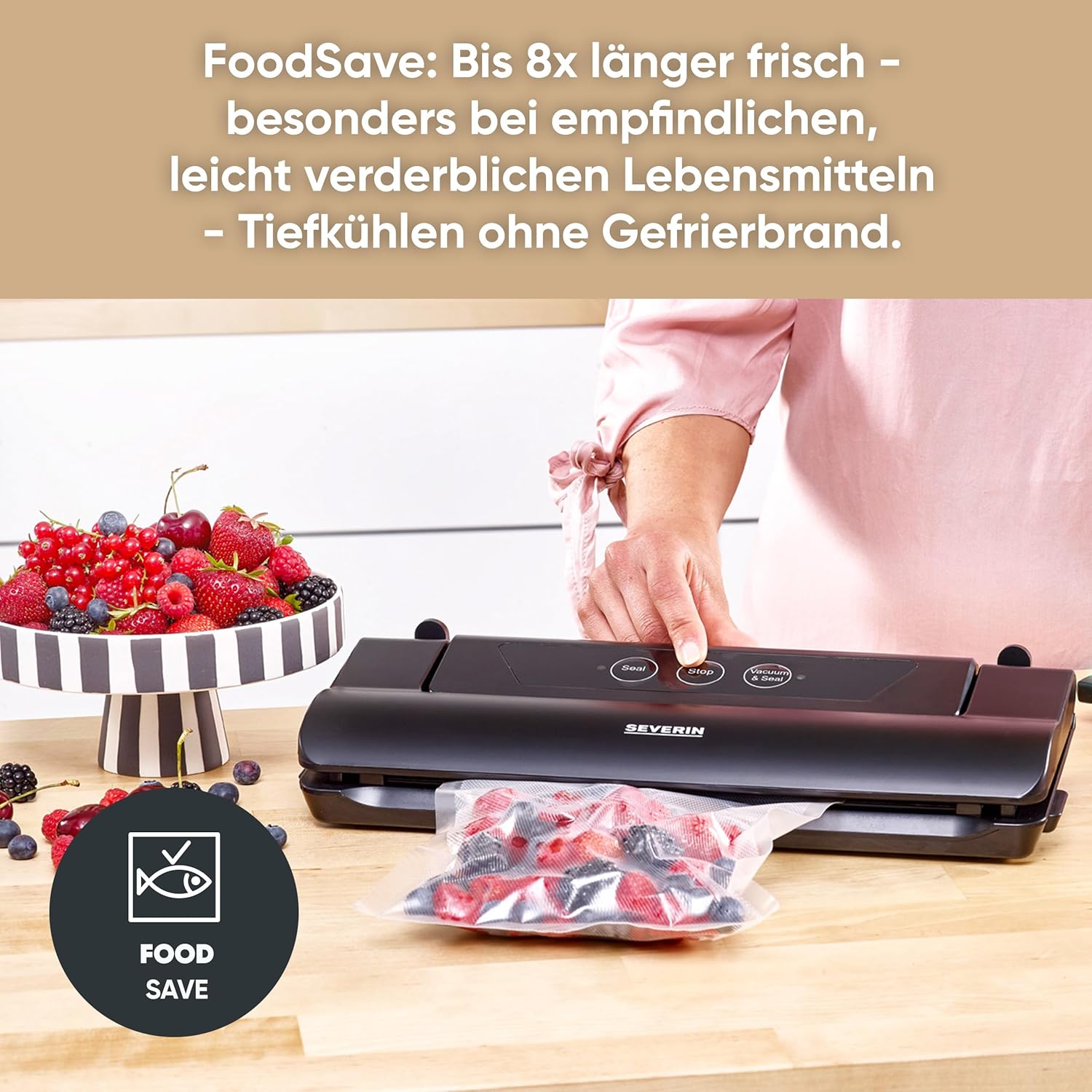 Vacuum sealer in use, sealing a bag of berries