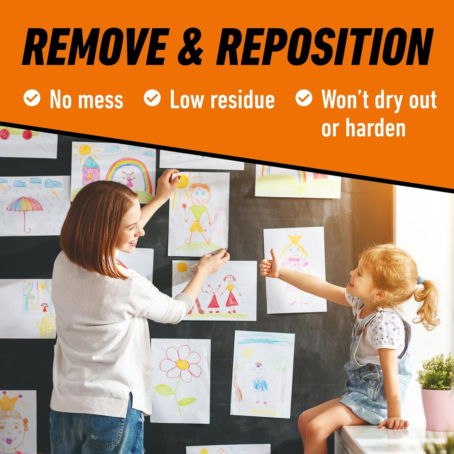 A woman and child applying artwork to a wall using Gorilla Mounting Putty, demonstrating its removability and repositionability.