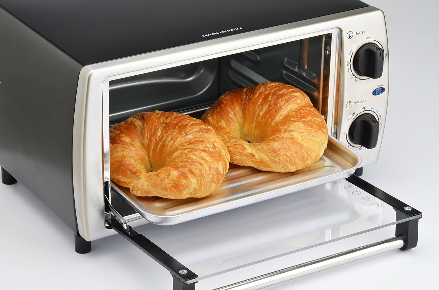 Two croissants baking inside the Toastmaster TM-103TR Toaster Oven