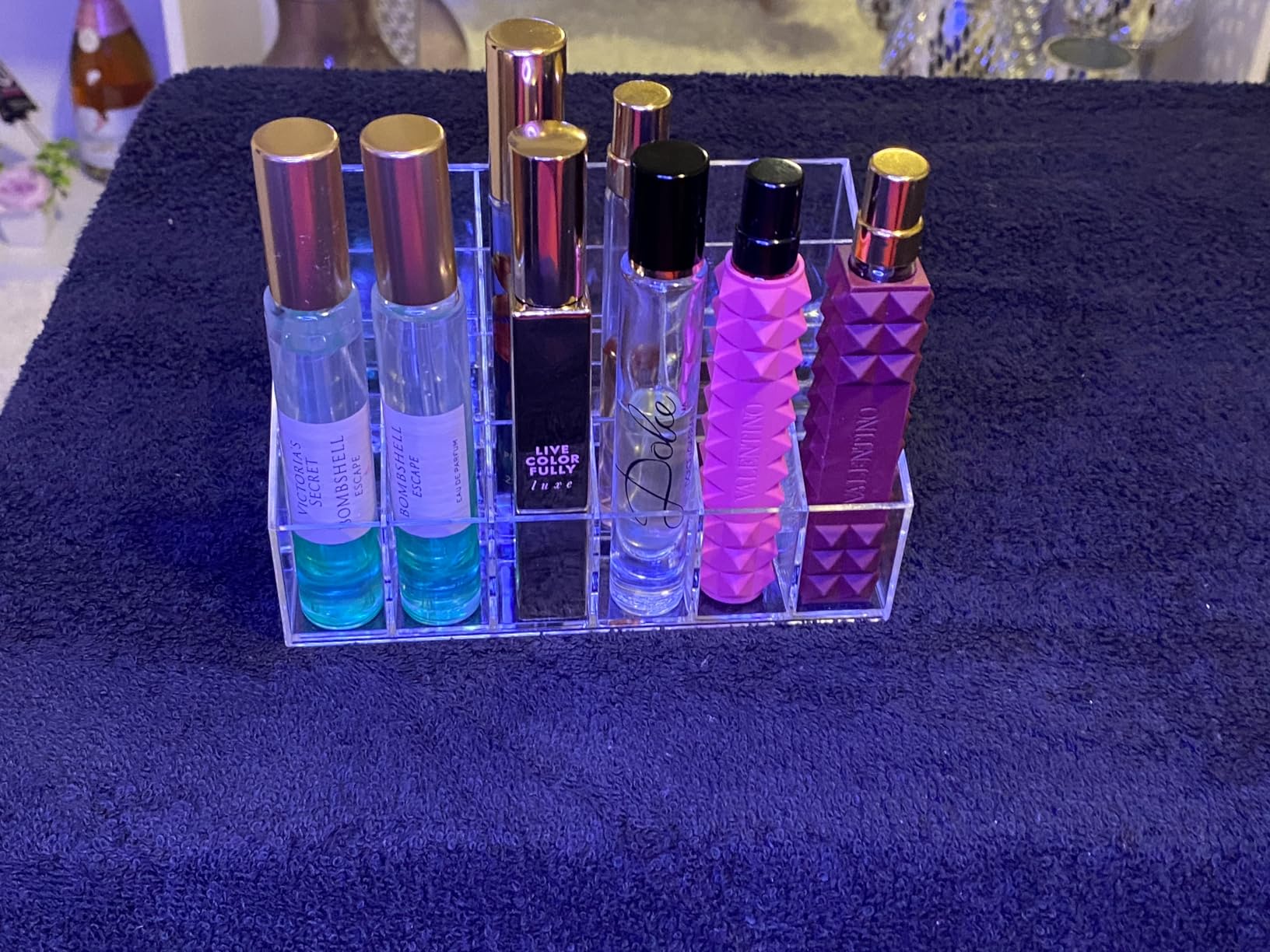 Dedicated lipstick station with rows of lipsticks displayed upright