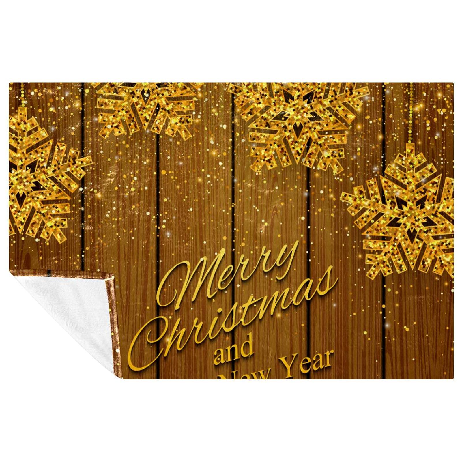 La couverture de Noël dorée douce à offrir pour réchauffer les soirées d'hiver
